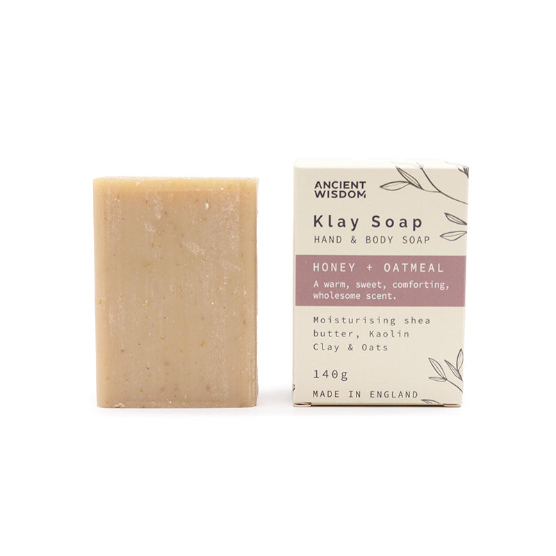 Bar of Klay Soap next to its packaging on a white background