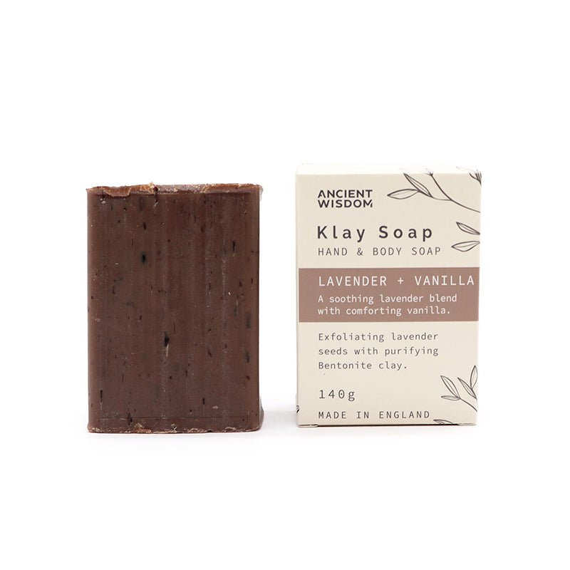 Bar of Klay Soap next to its packaging on a white background