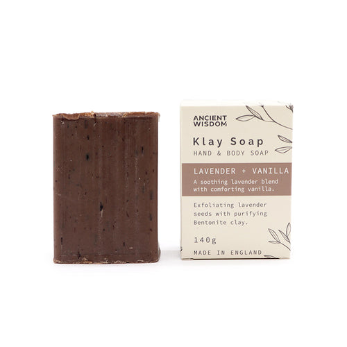 Bar of Klay Soap next to its packaging on a white background