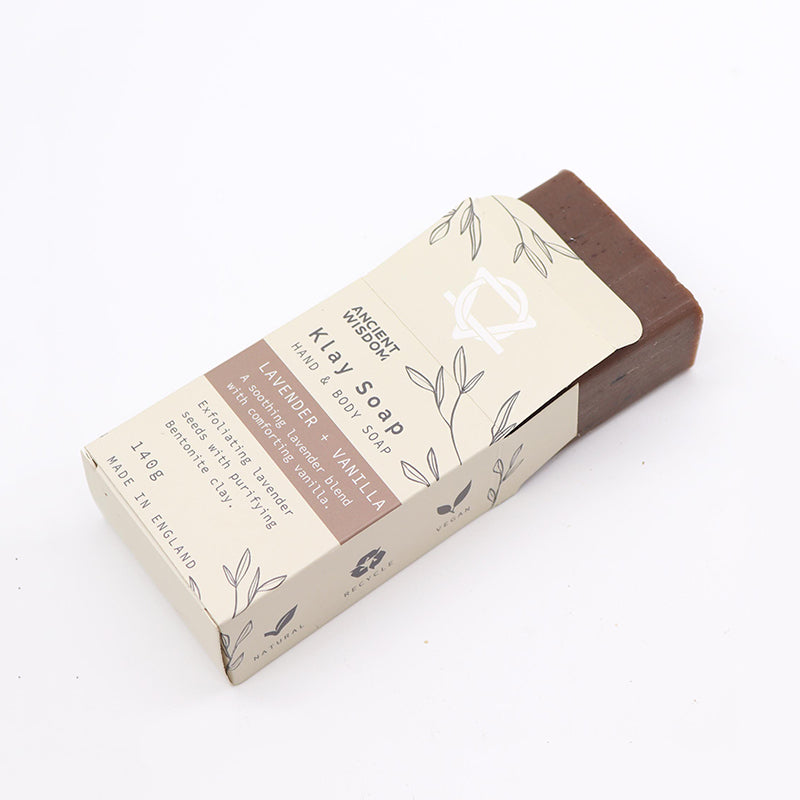 Bar of soap with a brown exterior and beige label on a white background