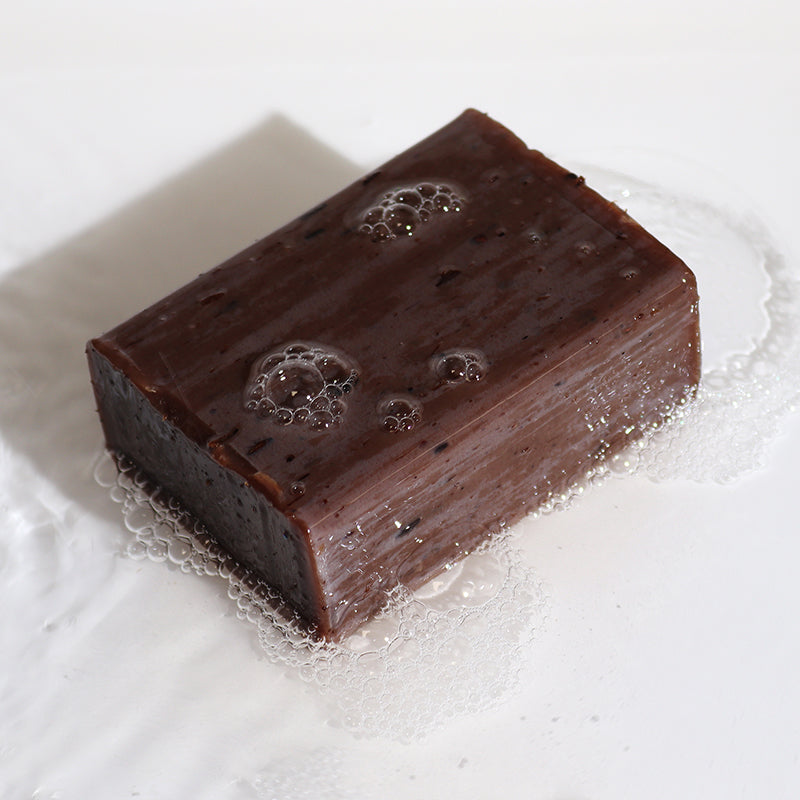 Chocolate bar with bubbles on a white background