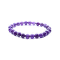 Purple beaded bracelet on a white background