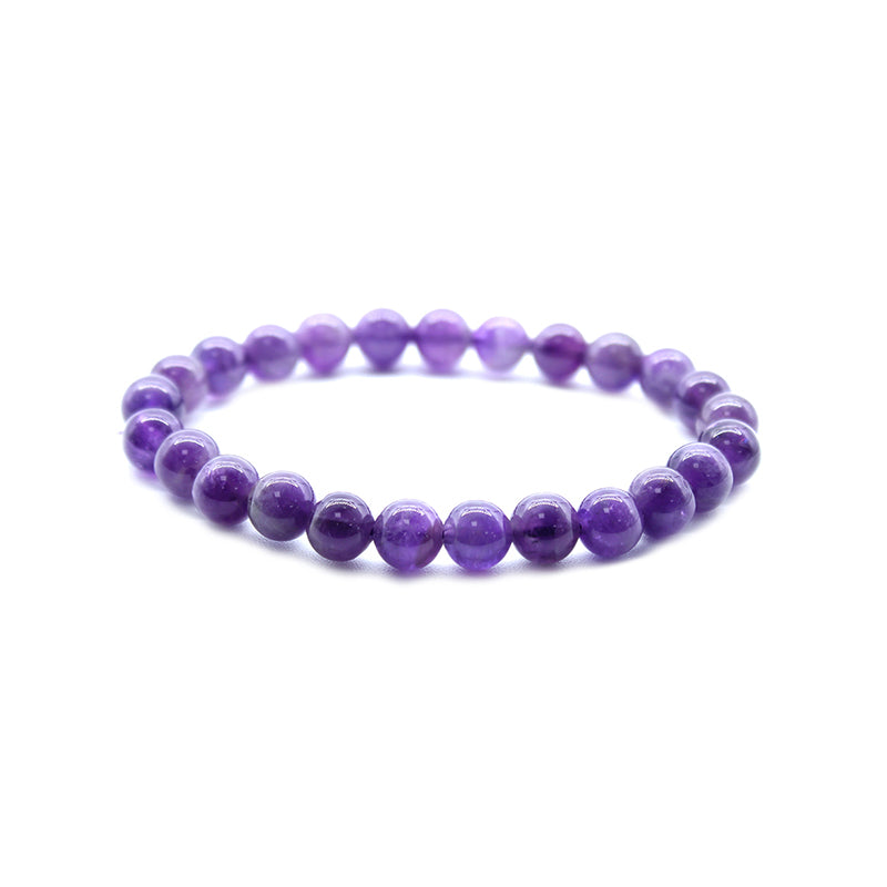Purple beaded bracelet on a white background